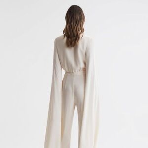 REISS OLIVIA CAPE SLEEVE V-NECK JUMPSUIT (IVORY)